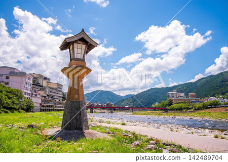 Scenery of a hot spring town: Hot spring source tower on the Hida River riverbed in Gero Onsen, Gifu Prefecture, Gero City. Scenery of a hot spring town: Hot spring source tower on the Hida River riverbed in Gero Onsen, Gifu Prefecture, Gero City. 142489704