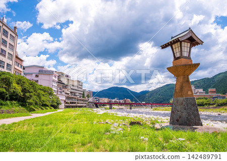 Scenery of a hot spring town: Hot spring source tower on the Hida River riverbed in Gero Onsen, Gifu Prefecture, Gero City. Scenery of a hot spring town: Hot spring source tower on the Hida River riverbed in Gero Onsen, Gifu Prefecture, Gero City. 142489791