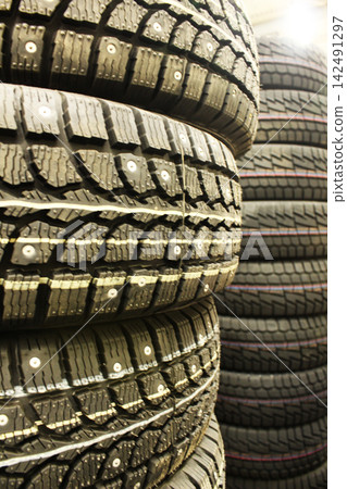Black car tires close-up. Tire Fitting Background. 142491297