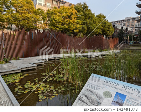 Portland, Oregon, USA - September 6, 2024: pond and Artwall landscape at Tanner Springs Park 142491378