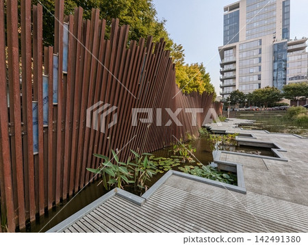 Portland, Oregon, USA - September 6, 2024: reclaimed railroad rail Artwall at Tanner Springs Park 142491380