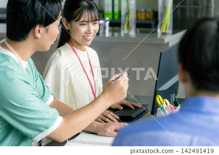 Male and female engineers having a meeting Male and female engineers having a meeting 142491419