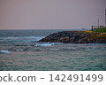 Stunning sunset over Indian Ocean on Hikkaduwa Beach Sri Lanka with calm waves 142491499