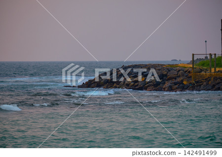 Stunning sunset over Indian Ocean on Hikkaduwa Beach Sri Lanka with calm waves Stunning sunset over Indian Ocean on Hikkaduwa Beach Sri Lanka with calm waves 142491499