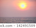 Stunning sunset over Indian Ocean on Hikkaduwa Beach Sri Lanka with calm waves 142491509