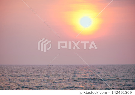Stunning sunset over Indian Ocean on Hikkaduwa Beach Sri Lanka with calm waves Stunning sunset over Indian Ocean on Hikkaduwa Beach Sri Lanka with calm waves 142491509