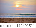 Stunning sunset over Indian Ocean on Hikkaduwa Beach Sri Lanka with calm waves 142491511