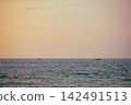 Stunning sunset over Indian Ocean on Hikkaduwa Beach Sri Lanka with calm waves 142491513
