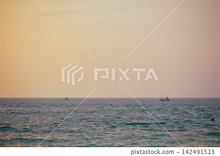 Stunning sunset over Indian Ocean on Hikkaduwa Beach Sri Lanka with calm waves Stunning sunset over Indian Ocean on Hikkaduwa Beach Sri Lanka with calm waves 142491513