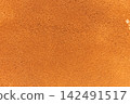 Macro close up of natural cork texture with warm terracotta brown tones 142491517