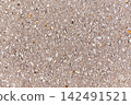 Close up macro texture of rough asphalt with gravel and stone inlays 142491521