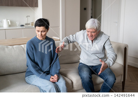 Older wife enduring verbal aggression from hysterical partner in toxic domestic struggle dependency Older wife enduring verbal aggression from hysterical partner in toxic domestic struggle dependency 142491644