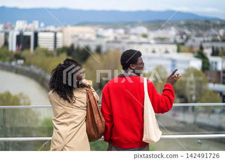 African american tourists visiting attractions in new city, married couple enjoying landmark view. African american tourists visiting attractions in new city, married couple enjoying landmark view. 142491726