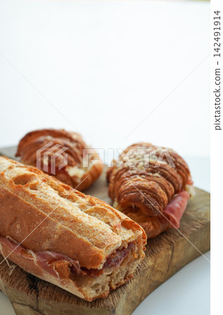 Croissant sandwich and baguette sandwich on a white background Croissant sandwich and baguette sandwich on a white background 142491914