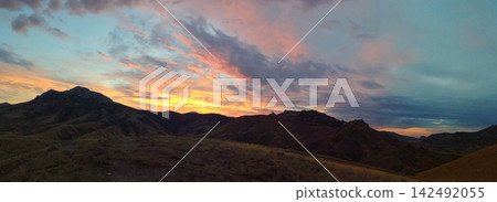 panoramic sunset over mountain ridges panoramic sunset over mountain ridges 142492055