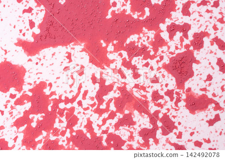 A pattern with a mottled texture of red and white, evoking a sense of the season. 142492078