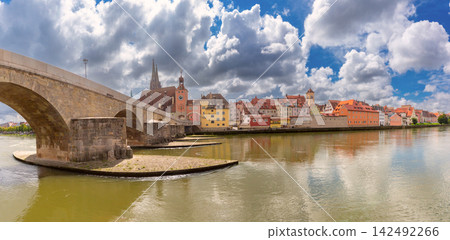 Stone Bridge and Danube River Waterfront in Regensburg, Germany 142492266