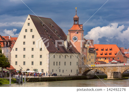 Historic Stone Bridge and Clock Tower in Regensburg, Bavaria, Germany Historic Stone Bridge and Clock Tower in Regensburg, Bavaria, Germany 142492276