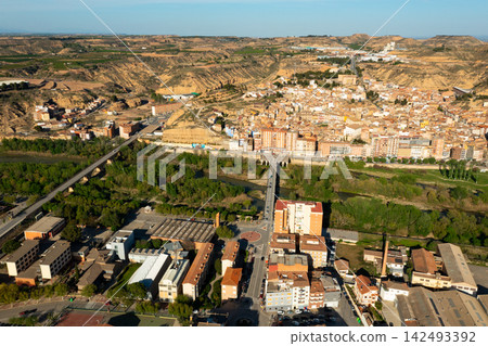 Aerial view of Fraga cityscape on banks of Cinca river Aerial view of Fraga cityscape on banks of Cinca river 142493392