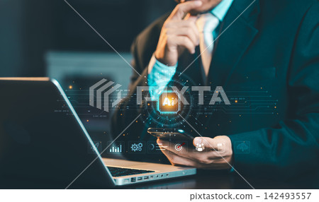 Businessman holding smartphone with glowing AI microchip hologram and business icons overlay, artificial intelligence and smart technology concept. Businessman holding smartphone with glowing AI microchip hologram and business icons overlay, artificial intelligence and smart technology concept. 142493557