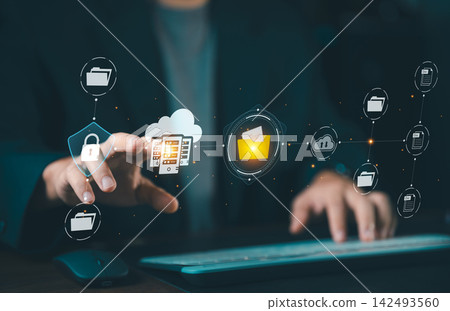 Businessman touching glowing cloud storage server hologram with secure document folders, cloud computing and data center management concept. Businessman touching glowing cloud storage server hologram with secure document folders, cloud computing and data center management concept. 142493560