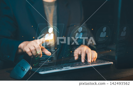 Businessman touching candidate profile hologram on screen, recruitment process, human resources management and candidate selection concept. Businessman touching candidate profile hologram on screen, recruitment process, human resources management and candidate selection concept. 142493562