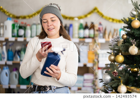 Woman scanning spray on mobile Woman scanning spray on mobile 142493574
