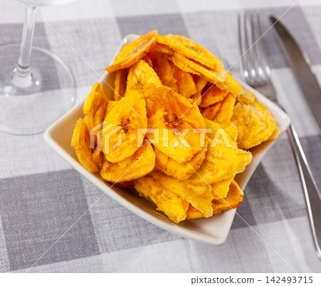 There is appetizer for low alcohol beverage - fried plantains chips There is appetizer for low alcohol beverage - fried plantains chips 142493715