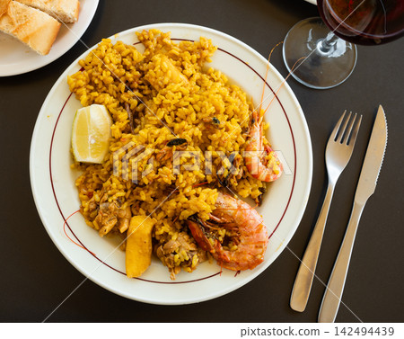 Paella with seafood served in a plate Paella with seafood served in a plate 142494439