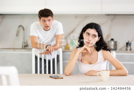 Man quarrels with his wife and shouts at her Man quarrels with his wife and shouts at her 142494456