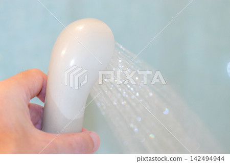 shower head spraying water shower head spraying water 142494944
