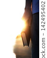A Christian holding the holy Bible, God's love, grace, faith, hope, and background of devotion 142495402