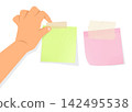 hand placing sticky note paper with tape for memo reminder and task 142495538