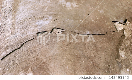 Cracked and worn brown concrete texture Cracked and worn brown concrete texture 142495543