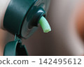 Close up of face cream coming from container 142495612