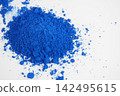 Bright blue powder on white surface 142495615
