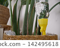 Self watering system for plants using a plastic bottle 142495618