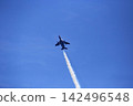 The Blue Impulse paints beautiful trails of smoke in the blue sky. 142496548