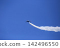 The Blue Impulse paints beautiful trails of smoke in the blue sky. 142496550