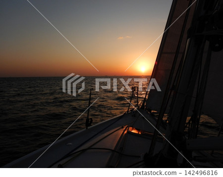 Sunrise as seen from a yacht Sunrise as seen from a yacht 142496816