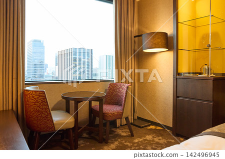Modern hotel rooms and living spaces with city views. Modern hotel rooms and living spaces with city views. 142496945