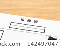 Close-up of an organizational chart and a ballpoint pen 142497047