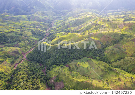 Landscape of Morning Mist with Mountain Layer. mountain ridge and clouds in rural jungle bush forest Landscape of Morning Mist with Mountain Layer. mountain ridge and clouds in rural jungle bush forest 142497220