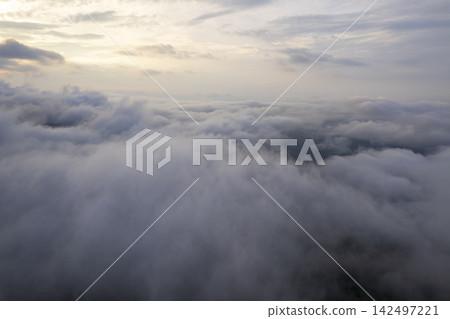 Landscape of Morning Mist with Mountain Layer. mountain ridge and clouds in rural jungle bush forest Landscape of Morning Mist with Mountain Layer. mountain ridge and clouds in rural jungle bush forest 142497221
