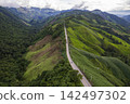 Landscape of Morning Mist with Mountain Layer. mountain ridge and clouds in rural jungle bush forest 142497302