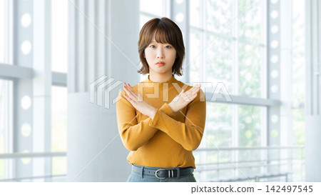 Angry woman/businesswoman making a "X" gesture with her hands Angry woman/businesswoman making a "X" gesture with her hands 142497545