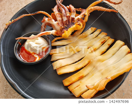 This is grilled semi-dried squid. This is grilled semi-dried squid. 142497696