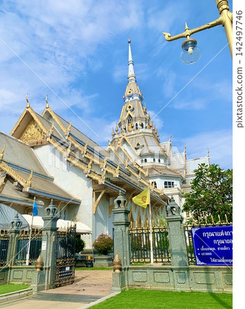 Exterior view of Wat Sothon, a temple in Thailand, under a blue sky. Exterior view of Wat Sothon, a temple in Thailand, under a blue sky. 142497746