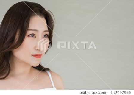 A beauty image of a mature woman (40s, 50s) with a beautiful profile and ample space for copy. A beauty image of a mature woman (40s, 50s) with a beautiful profile and ample space for copy. 142497936