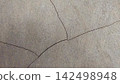 Cracks on the weathered concrete surface. 142498948
